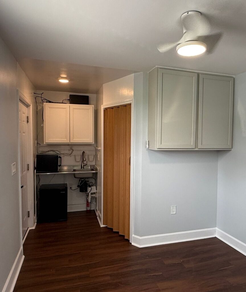 Studio apartment with kitchenette and overhead storage at 4843 Old Dixie Highway Forest Park GA